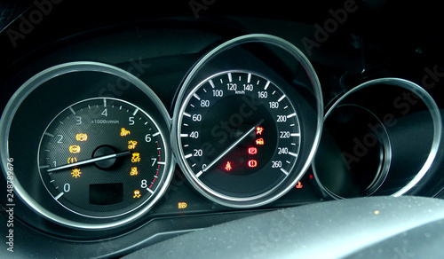 Car dial indication on modern dashboard with backlight inside a vehicle © AnyVIDStudio