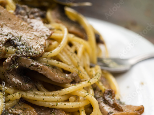 tasty Italian pasta with mushrooms close up