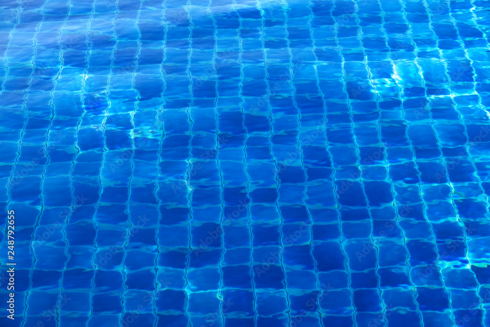 Blue abstract mosaic tiles at the bottom of the swimming pool, background. Blue abstract mosaic tiles at the bottom of the swimming pool, background.