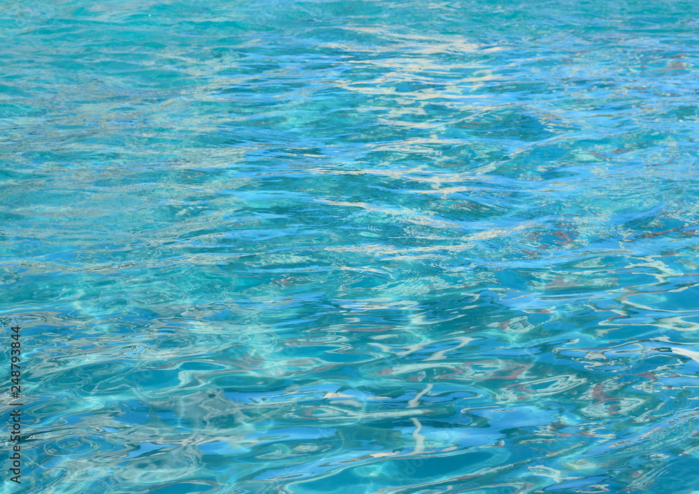 Clear turquoise water surface background Clear turquoise water surface background
