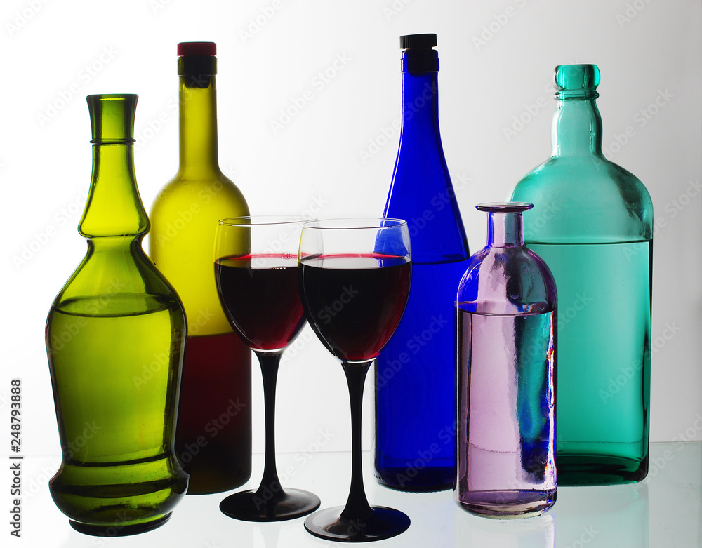 Bottles with wine, liqueurs and spirits on a white background. Bottles with wine, liqueurs and spirits on a white background.