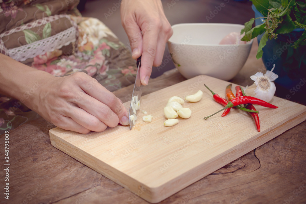 She prepares ingredients for cooking. She prepares ingredients for cooking.