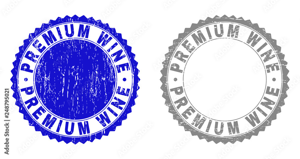 Obraz premium Grunge PREMIUM WINE stamp seals isolated on a white background. Rosette seals with distress texture in blue and grey colors. Vector rubber stamp imprint of PREMIUM WINE label inside round rosette.