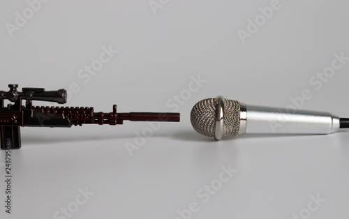 Photos facing miniature guns and microphones