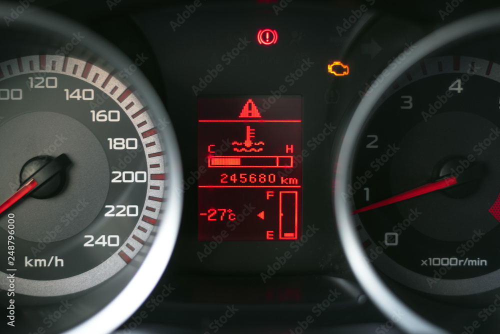 Low level fuel symbol on a car dashboard. Need a fueling concept background. Low level fuel symbol on a car dashboard. Need a fueling concept background.