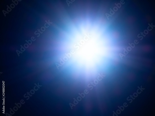 Image of very bright strong sunbeam in summer.