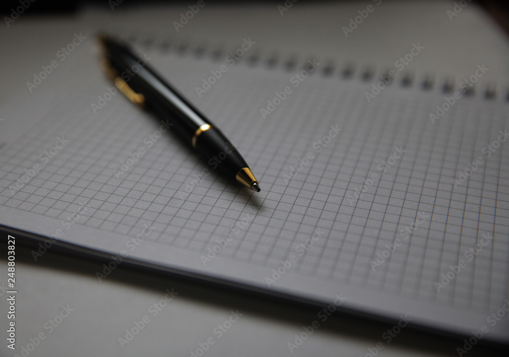 Pen on notepad on the wooden table. writing and thinking concept. Pen on notepad on the wooden table. writing and thinking concept.