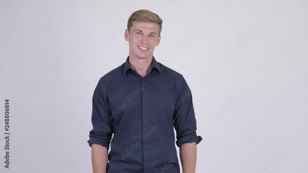 Happy young handsome blonde businessman smiling Happy young handsome blonde businessman smiling