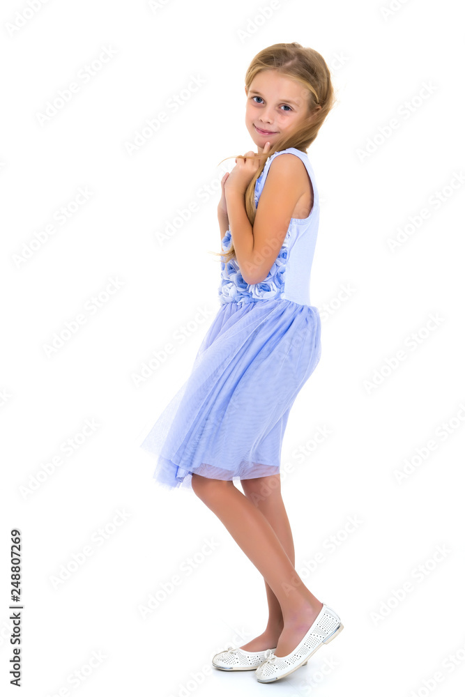 Little girl in a dress developing in the wind. Little girl in a dress developing in the wind.