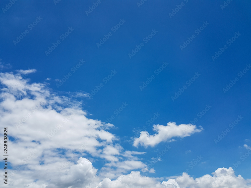 Soft white tiny clouds and blue sky background on sunny day for abstract background or insert text copy space. Soft white tiny clouds and blue sky background on sunny day for abstract background or insert text copy space.