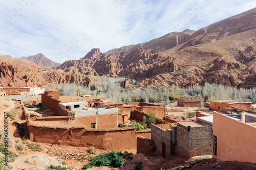Berber village in mountains. Morocco tourism: trekking man in mountains. Atlas mountains, Jebel Sakhro (Djebel Sahro), Ourzazate, Morocco