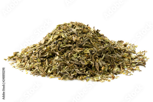 A pile of dried chopped provence herbs isolated on white.