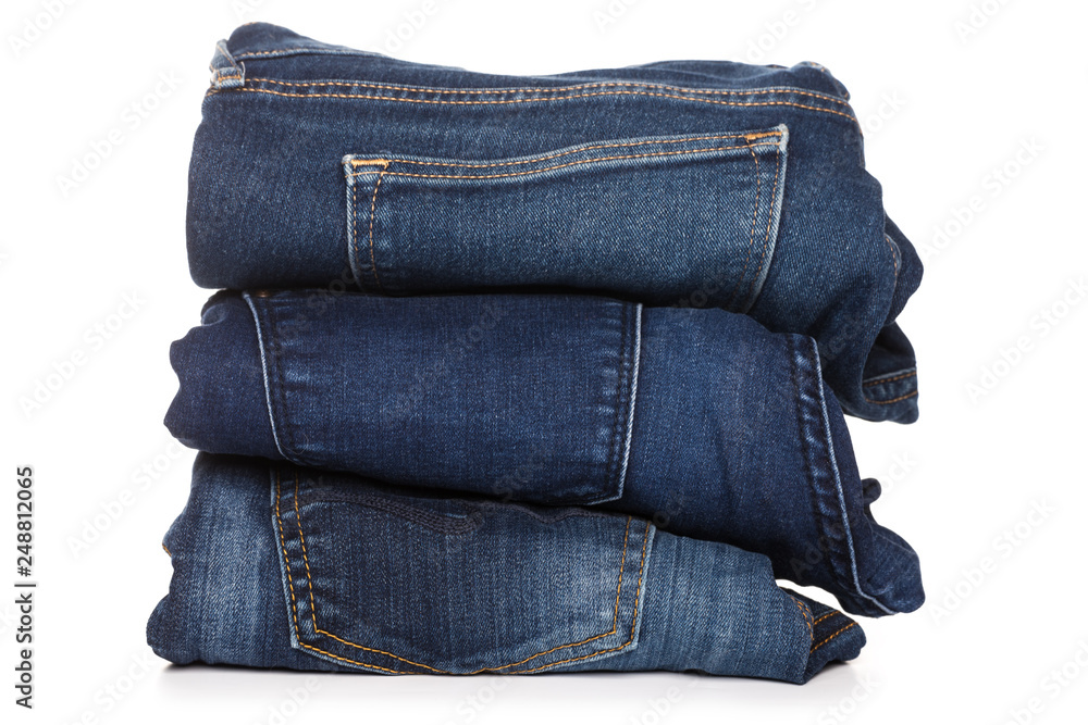 Jeans trousers stack on white background Jeans trousers stack on white background