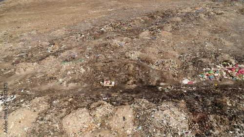 Pollution with a lot of Waste in a nice desert landscape. Aerial from South America, Peru photo