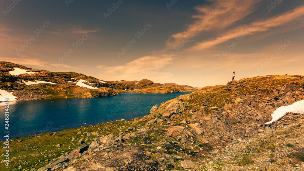 Tourist enjoying landscape norwegian nature