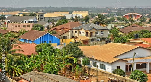 Residential area in Africa. Top view on houses surrounded by fences and gardens. Modern lifestyle in developing countries. Beautiful urban landscape