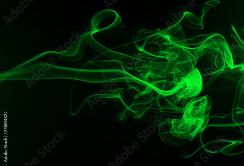 Abstract green smoke on black background, darkness concept