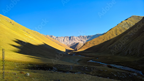 Sunset view to Tash-Rabat river and valley in Naryn province, Kyrgyzstan photo