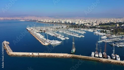 Aerial drone video of famous marina of Alimos with yachts and sailboats docked, Athens riviera, Attica, Greece photo