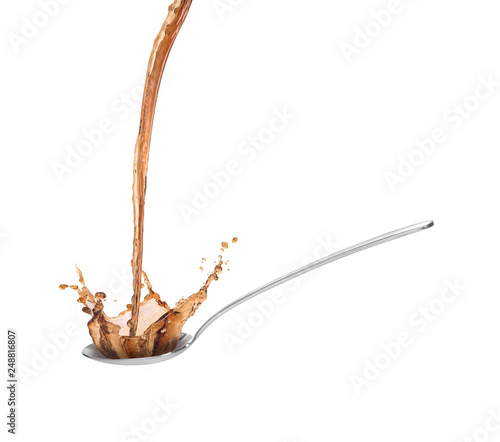 metall spoon with soy sauce splash isolated on white