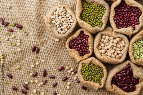 Dry legumes seed on linen fabric background, Different type of Bean seeds in sack bag, top view