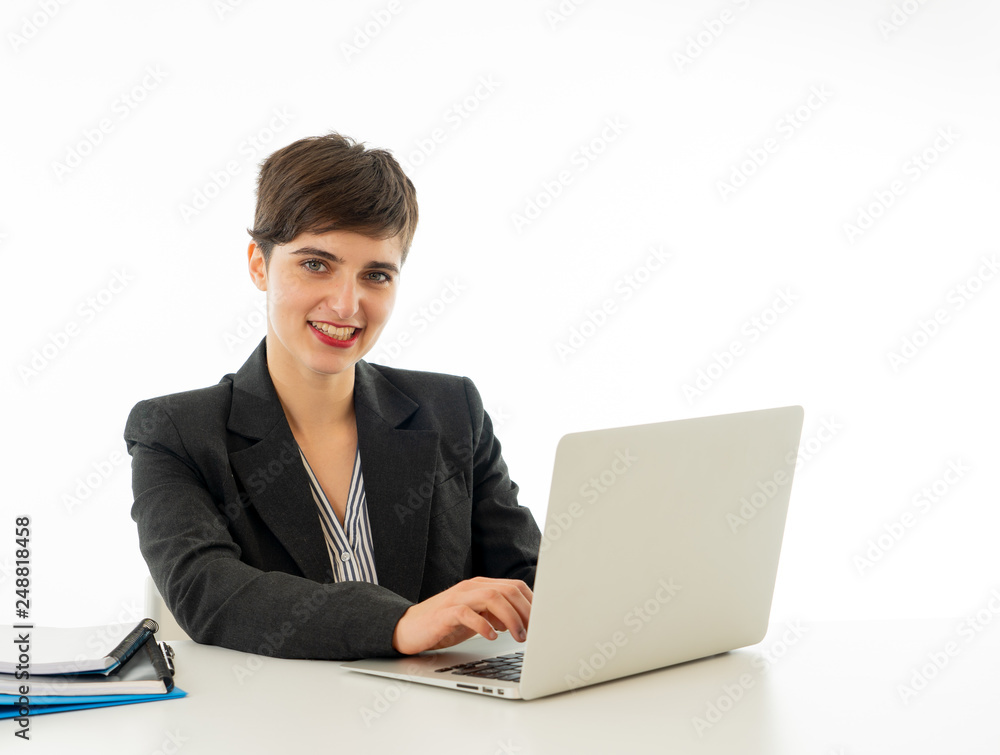 Portrait of happy attractive young businesswoman working on her laptop looking confident Portrait of happy attractive young businesswoman working on her laptop looking confident
