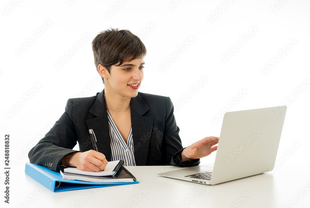 Portrait of happy attractive young businesswoman working on her laptop looking confident Portrait of happy attractive young businesswoman working on her laptop looking confident