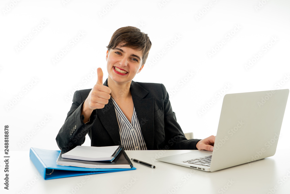 Portrait of happy attractive young businesswoman on laptop looking confident with thumb up Portrait of happy attractive young businesswoman on laptop looking confident with thumb up