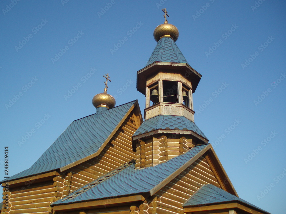 wooden Orthodox Church with bell tower