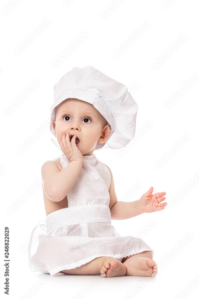 Close up portrait of a baby sitting wearing a chef hat, isolated on white. big size resolution. Food banner for text or design Close up portrait of a baby sitting wearing a chef hat, isolated on white. big size resolution. Food banner for text or design