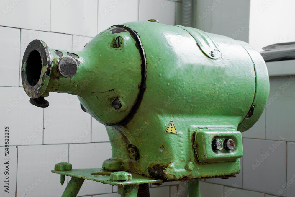 Old Soviet electric meat grinder in the industrial kitchen Old Soviet electric meat grinder in the industrial kitchen