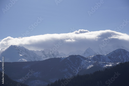 Mountain landscape. View of the Tatras in Zakopane. February winter sunny day © Anatoliy