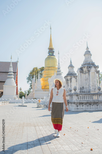 Traveller girl walking in the temple,Wat Suan Dok,Chaing Mai,Thailand.