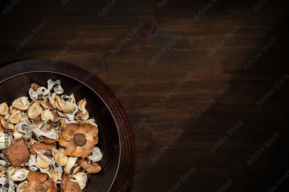 Potpourri - Scented dry plants in wooden bowl Potpourri - Scented dry plants in wooden bowl