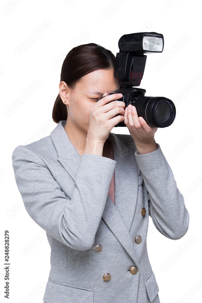 Asian Woman Photographer hold camera with external flash point to shoot subject, wear formal black suit. studio lighting white background isolated copy space, reporter journalist take photo celebrity Asian Woman Photographer hold camera with external flash point to shoot subject, wear formal black suit. studio lighting white background isolated copy space, reporter journalist take photo celebrity