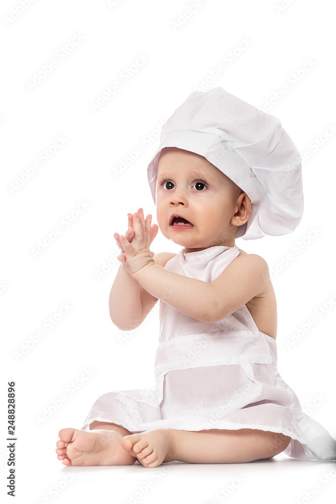 Little Chef. funny baby emotions. Adorable baby boy dressed in s chef's hat. isolated on white. big size resolution. Food banner for text or design Little Chef. funny baby emotions. Adorable baby boy dressed in s chef's hat. isolated on white. big size resolution. Food banner for text or design