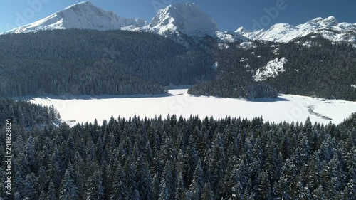Aerial winter view of snow covered Black lake in Durmitor mountains national park