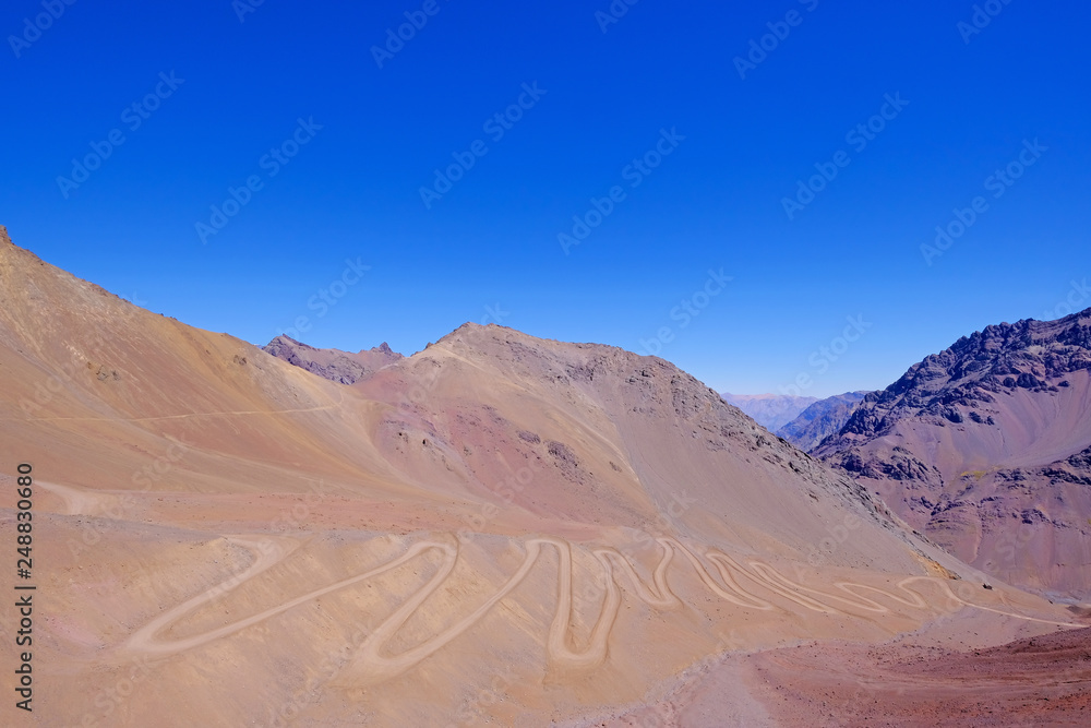 Old dangerous mountain road of the Paso de la Cumbre or Cristo Redentor in the Andes between Argentina and Chile