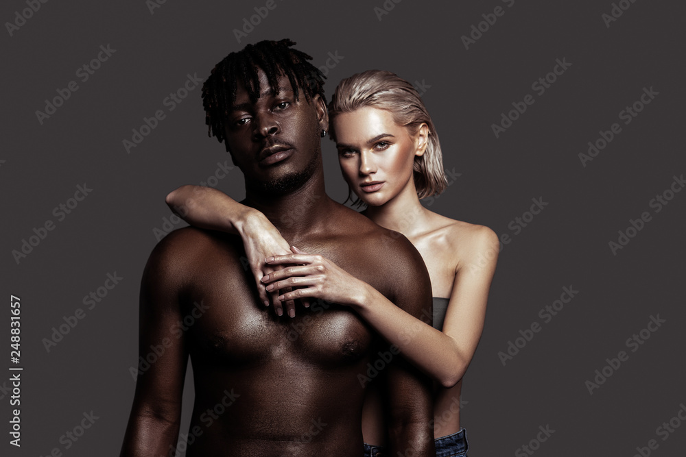 Young model hugging her handsome African-American boyfriend