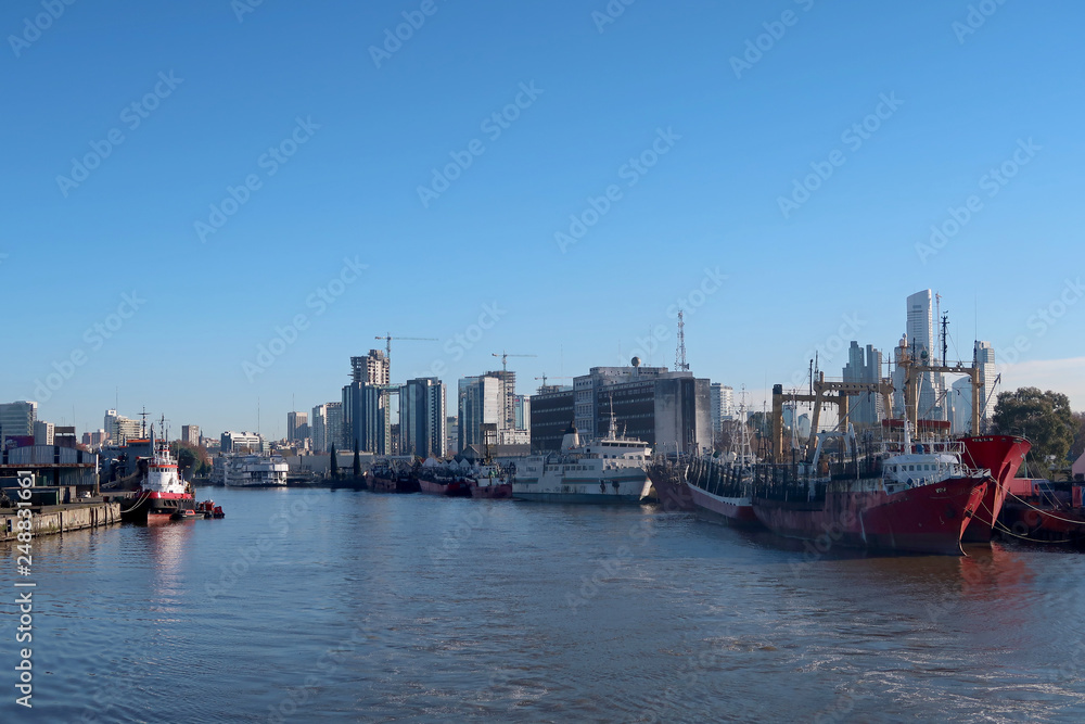 Ships at the port harbor of Buenos Aires, cityscape in the background, Argentina, South America