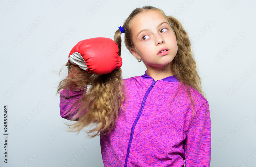 Skill of successful leader. Girl cute child with red gloves posing on white background. Sport upbringing for leader. Cute kid with sport boxing gloves. Boxing sport for female. Sport upbringing Skill of successful leader. Girl cute child with red gloves posing on white background. Sport upbringing for leader. Cute kid with sport boxing gloves. Boxing sport for female. Sport upbringing
