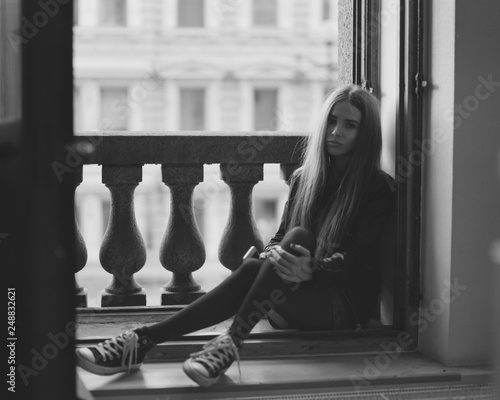 Cute brunette girl posing for film photos at the city