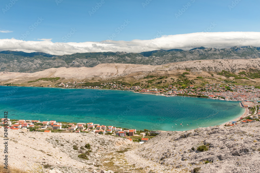 Panorama of Pag town on Pag island with Velebit mountains on background, Kvarner, Croatia