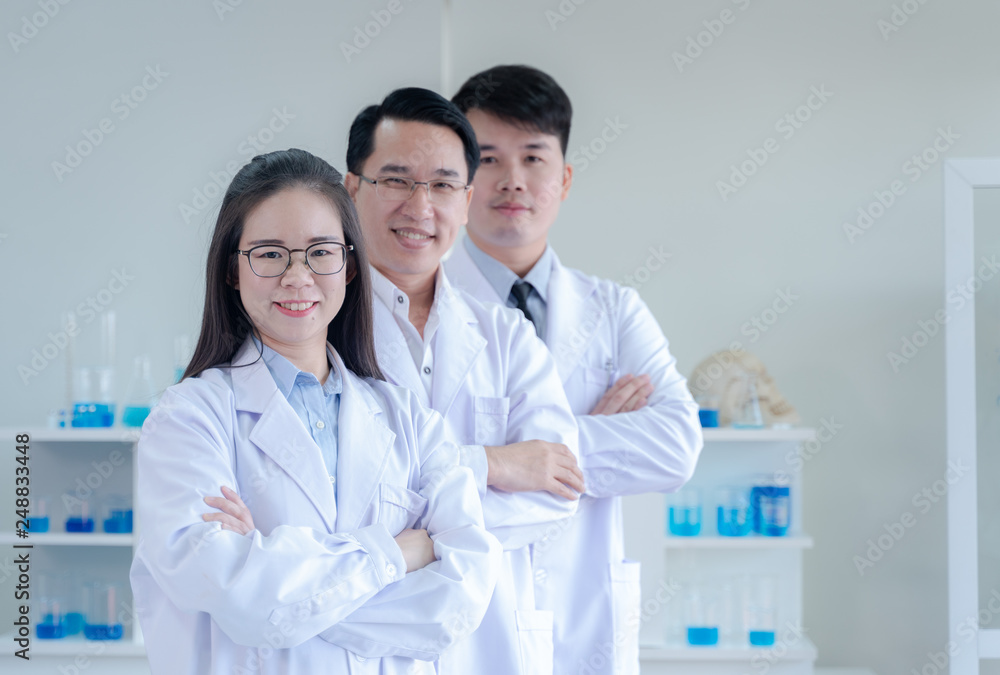 scientists standing and crossing arms scientists standing and crossing arms
