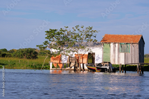 House on stilts at the Rio Paraguay river in the Pantanal, near Corumba, Mato Grosso Do Sul, Brazil photo