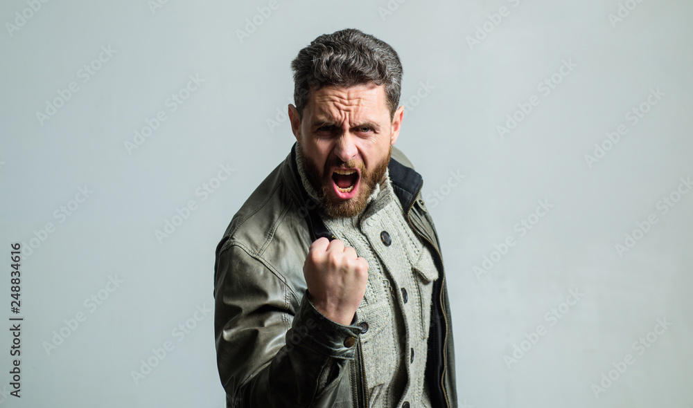 Overwhelmed with emotions. Shouting mature man screaming. Man brutal bearded hipster shouting face. Shouting and threaten violence. Threatening gesture fist. Aggression concept. Man shouting loudly Overwhelmed with emotions. Shouting mature man screaming. Man brutal bearded hipster shouting face. Shouting and threaten violence. Threatening gesture fist. Aggression concept. Man shouting loudly