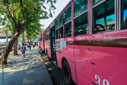 Bangkok, Thailand - March 2, 2017: Pink bus line number 8, starting point from the memorial bridge (Saphan Phut) to Happy Land, Minburi. Bus nummber 8 line is famous of fast and swiftly in Bangkok. photo