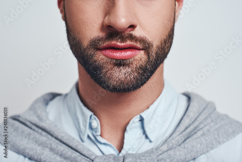Perfect beard. Close-up cropped image of a handsome young man with a beard photo