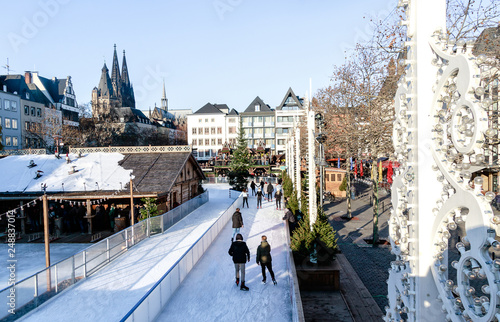 Cologne, Germany - wintertime in the Old Town. In this fairy-tale atmosphere, a unique skating rink fits into the Heumarkt (Hay Market). photo