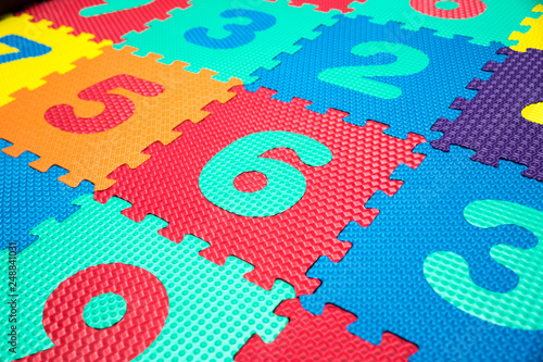 Colorful Baby Mat. Rubber foam pad for children playing. Colorful background ackground with digits © Andre